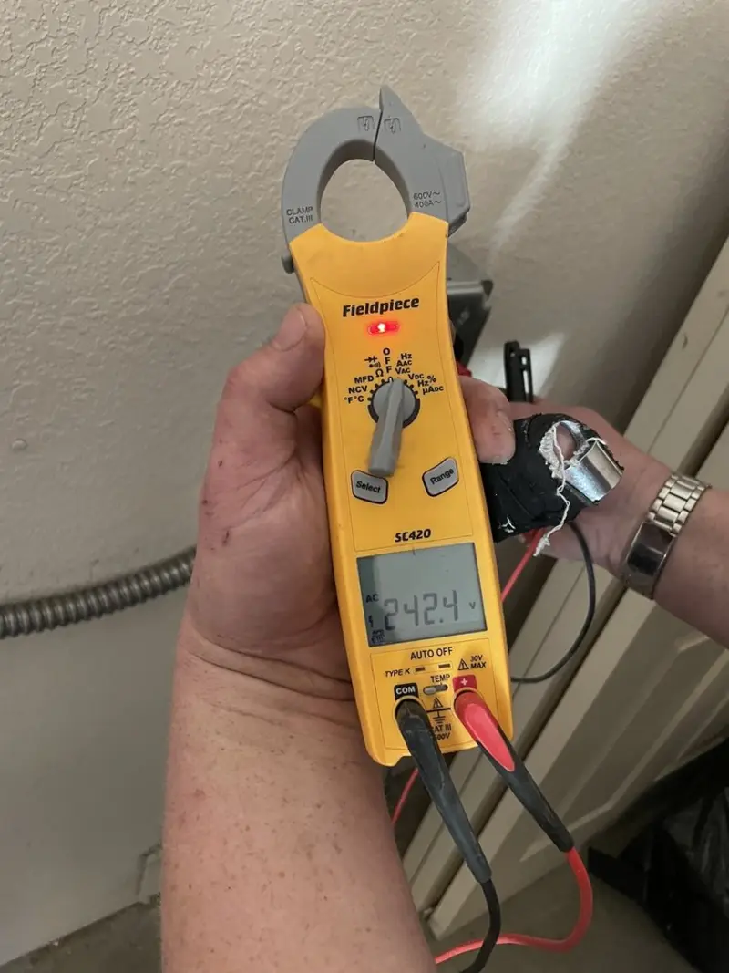 Voltage testing with clamp meter during Outlet Installation in Santa Paula